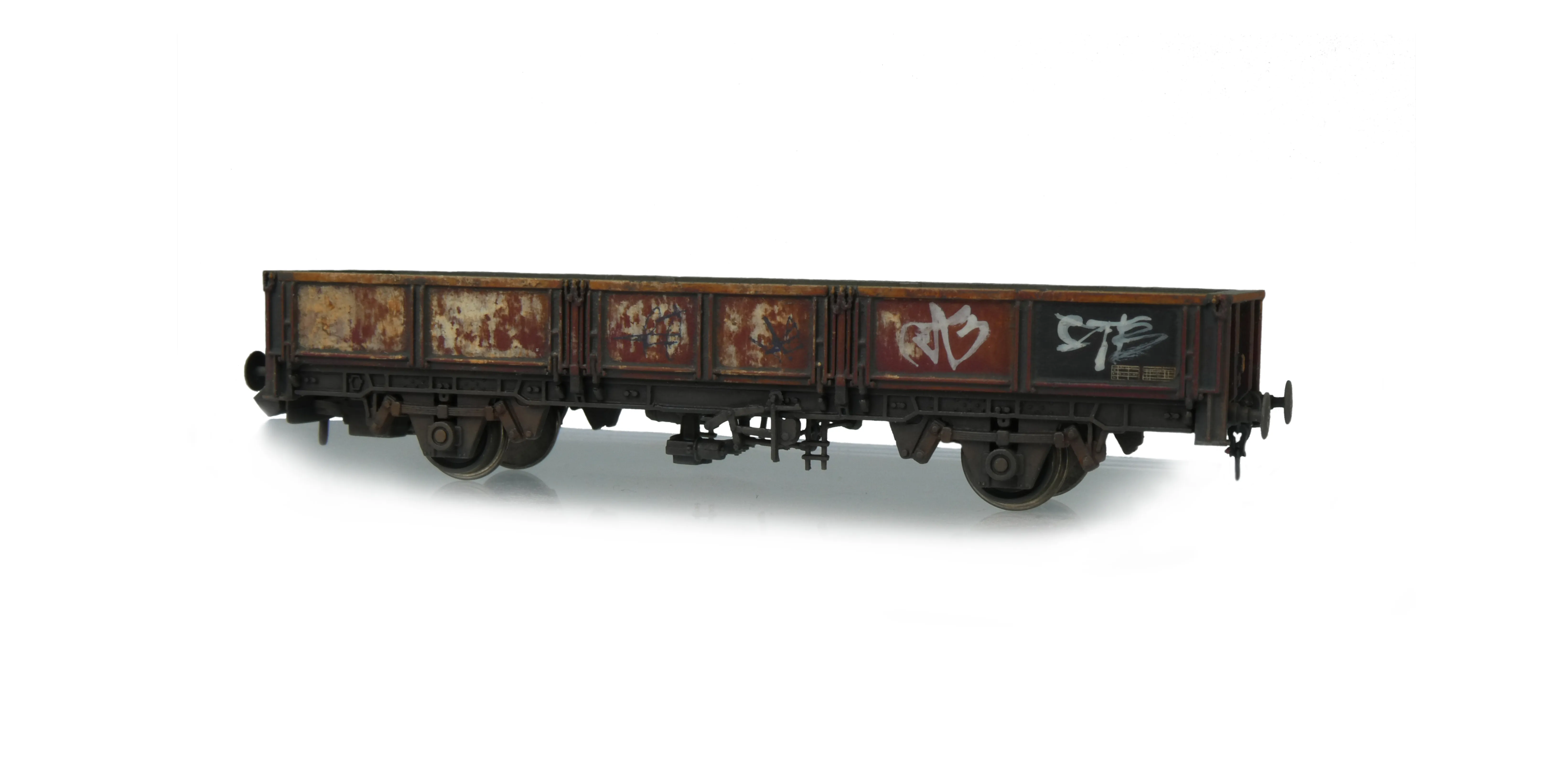Heavily weathered and graffitied open wagon