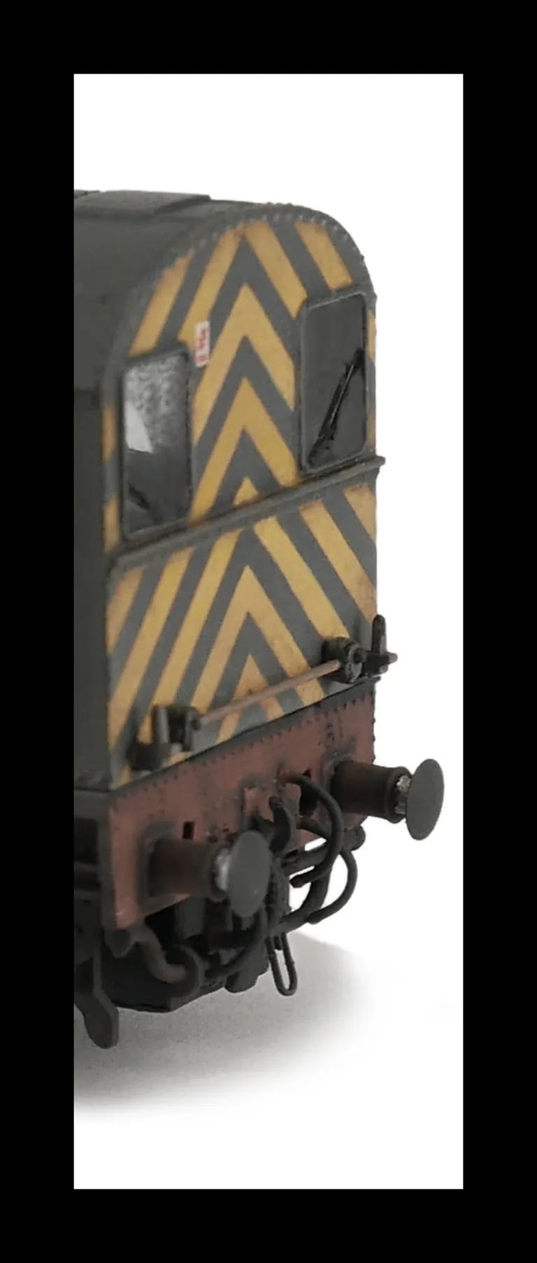 Close up of buffer beam with the extra pipework below the pipes.