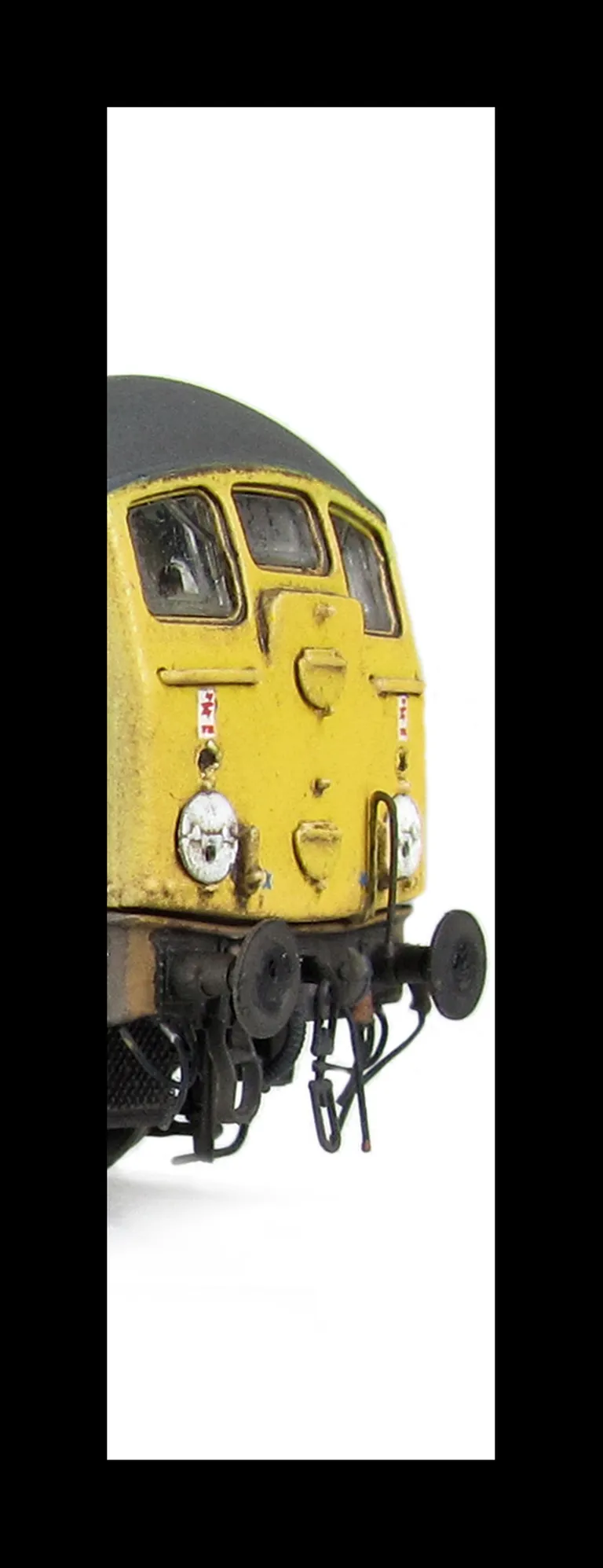 24107 conversion to a plated over end door version with centre disc arrangement, etched work plates, extra pipe on nose as per prototype, battery box modification, body side steps plated over, detailed buffer beam at one end and semi detailed at coupling 