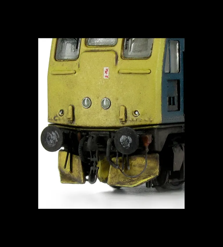 24132 conversion to a plated over end door version with centre headlights, battery box modification with shorter tank, body side steps plated over and new side door, detailed buffer beam at one end with semi detailed beam at coupling end, renumbered, weat