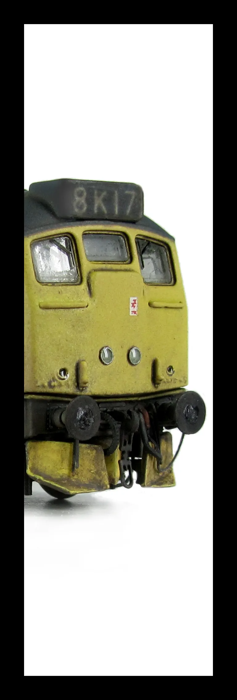 24132 conversion to a plated over end door version with centre headlights, battery box modification with shorter tank, body side steps plated over and new side door, detailed buffer beam at one end with semi detailed beam at coupling end, renumbered, weat