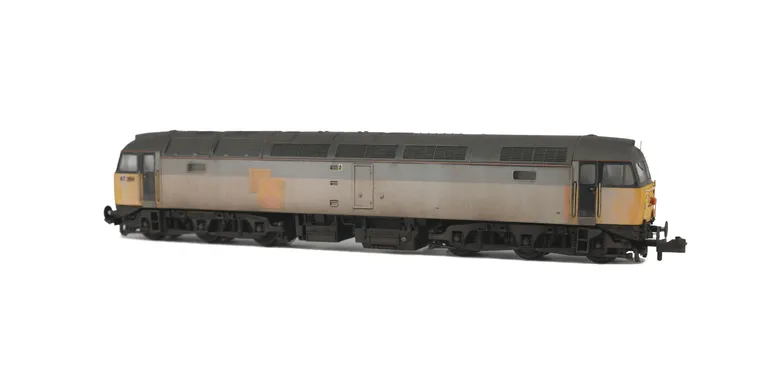 47284 in dilapidated faded state. Details include: converted to cutaway buffer beams, semi respray of yellow cabs with grey undercoat showing through in some areas, rubbed off sector decals, pipe on nose, finer aerials, body lowered, etched roof fan and g