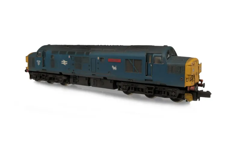 37012 with conversion to a cutaway buffer beam version. Modifications include; etched headcode covers, renumbered, bogie modification to reduce gap between body and bogies, moulded roof grill replaced with 3D etched fan and grill, speedo cable added, nose