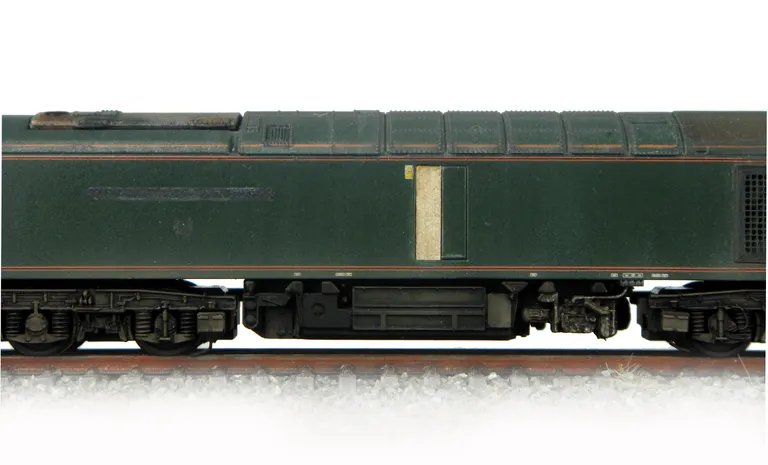 60081 representing it's condition on on the scrap-line. Special effects include engine door boarded up, EWS maroon door, nameplates and plaques taken off with textured shadows, rust and fading with notes on windows. Model has also had it's body lowered an