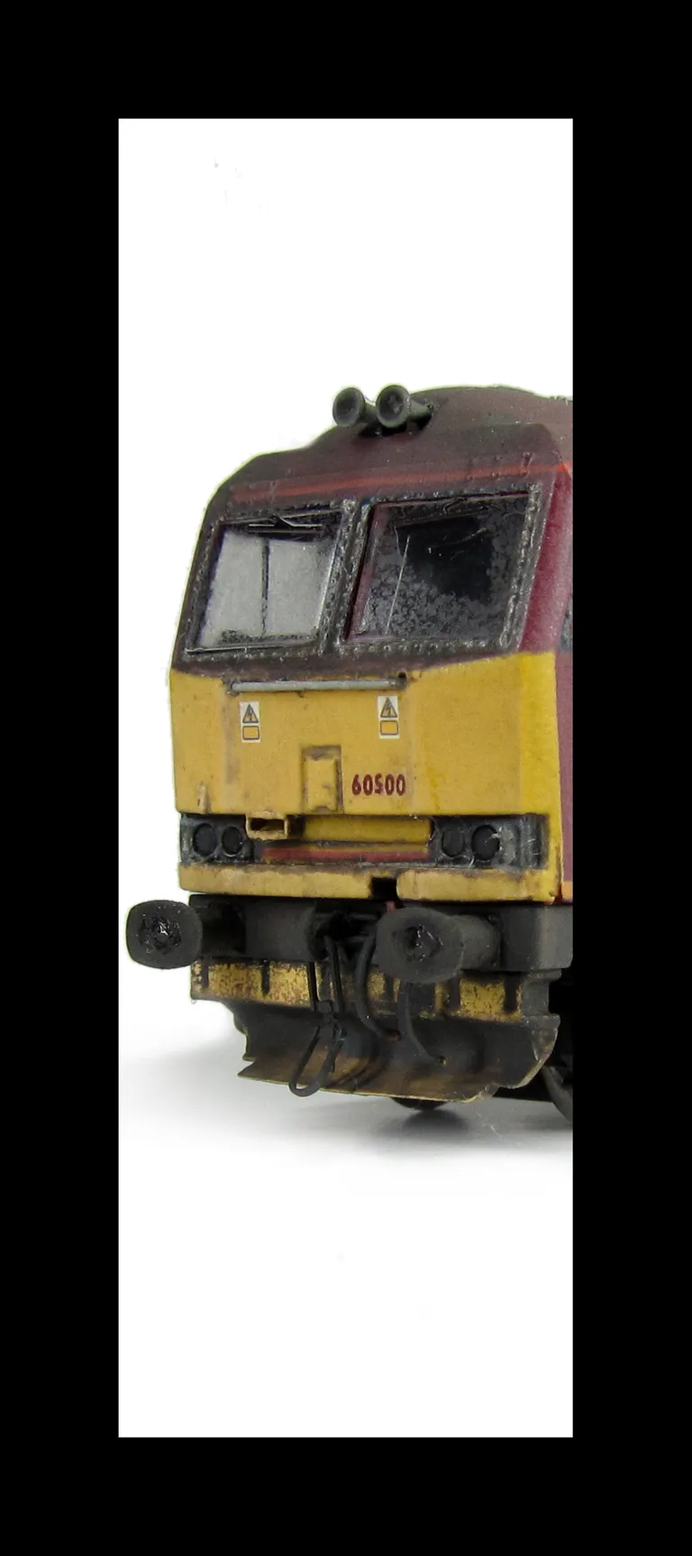 60500 with faded body, detailed buffer beam at one end, yellow ploughs and chipped silver window surrounds, renumbered, etched nameplates/symbols and driver fitted.