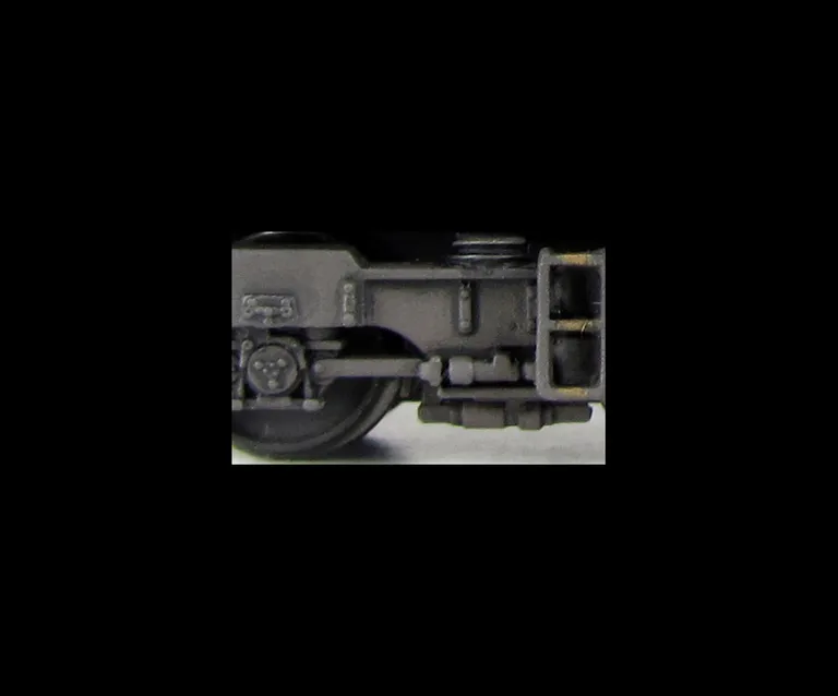 Close up of bogie frames with added springs on the top.