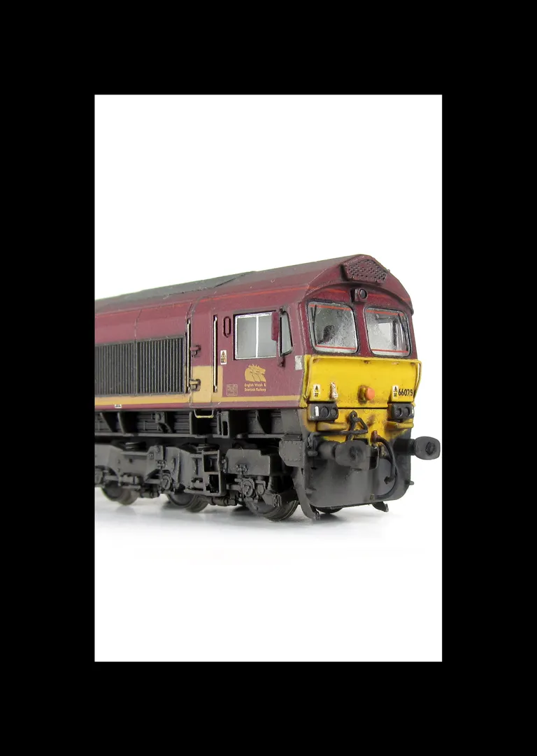 66075 with faded paintwork. Moulded front handrails replaced with wire versions including pommels, springs added to bogie frames, front lashing eyes removed and moved, moulded steps below doors replaced with wire versions, moulded roof grill replaced with