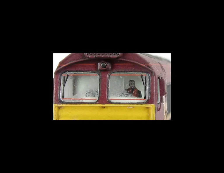 Close up of moulded front handrails that have been replaced with wire versions including pommels, wing mirrors and fitted driver.