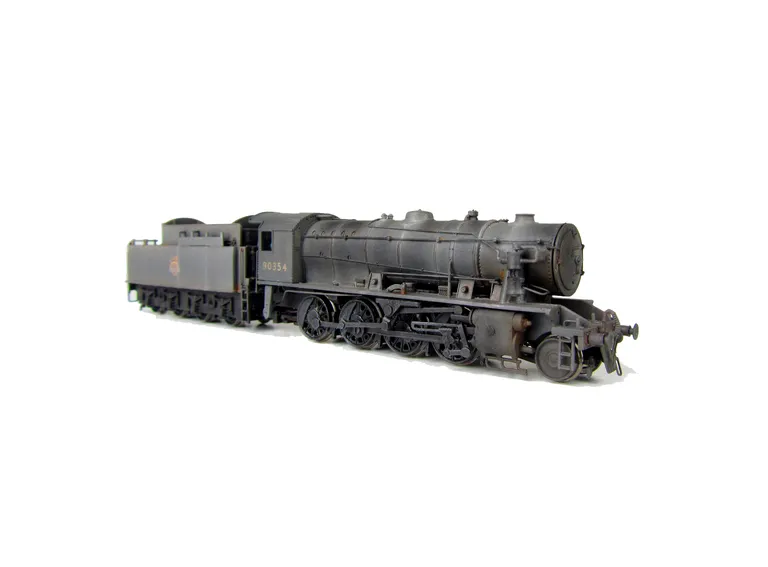 WD Austerity 90354 weathered to represent the last days of steam. Added details include: renumbered, molded coal replaced with real coal, loco crew added, fire irons, detailed buffer beam at one end and painted cab interior.