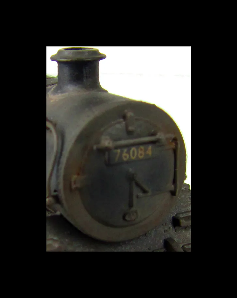 4MT 76084 weathered to represent the last days of steam. Added details include: renumbered, molded coal replaced with real coal, loco crew added, fire irons, etched depot plaques and work plates, detailed buffer beam at one end and painted cab interior.