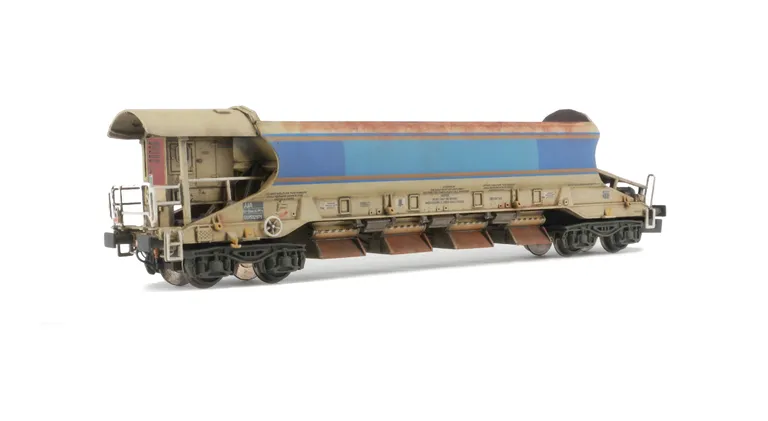 Autoballaster re liveried with blanking patch sprayed over former logo, detailed buffer beam, tail light and and load added.