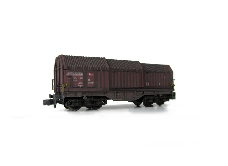 Wagon with faded paintwork and added graffiti.