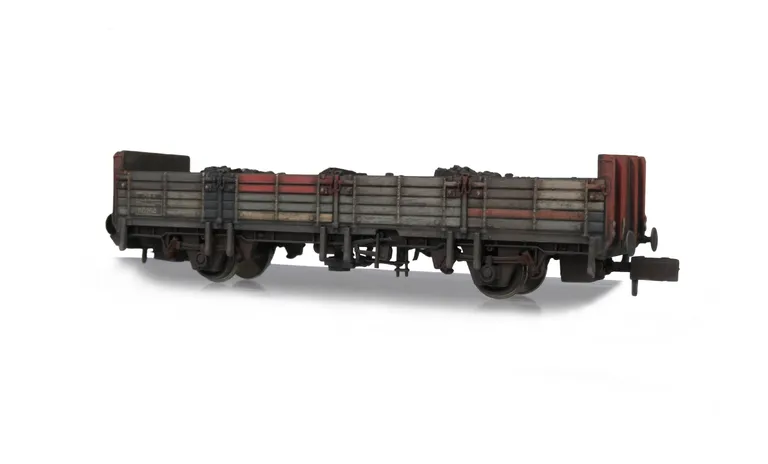 with flaking paint and different coloured slats where they have been replaced over time.