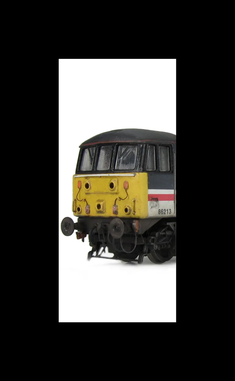 86213 with livery errors corrected, pommel added to nose handrails, etched nameplates, detailed buffer beam at one end with added bar, driver fitted, pantograph changed to finer version, brass buffers, semi detailed buffer beam at coupling end and moulded
