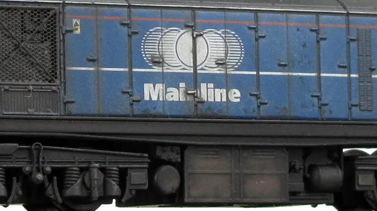 Detailed buffer beam at one end.  Renumbered  Etched depot plaques.  Faded body and paint chipping.  Livery errors corrected and white cantrail added. Pommels added to nose end handrails. Finer MU sockets. Small nose side grills added.