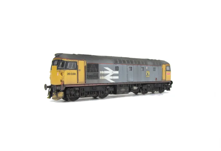 26038 with modified livery, Added details include: Highland stag motif, snowploughs, renumbered, battery box cables added. speedo cable added to one bogie, body window frames taken off and made flush, moulded front handrails replaced with wire versions, b