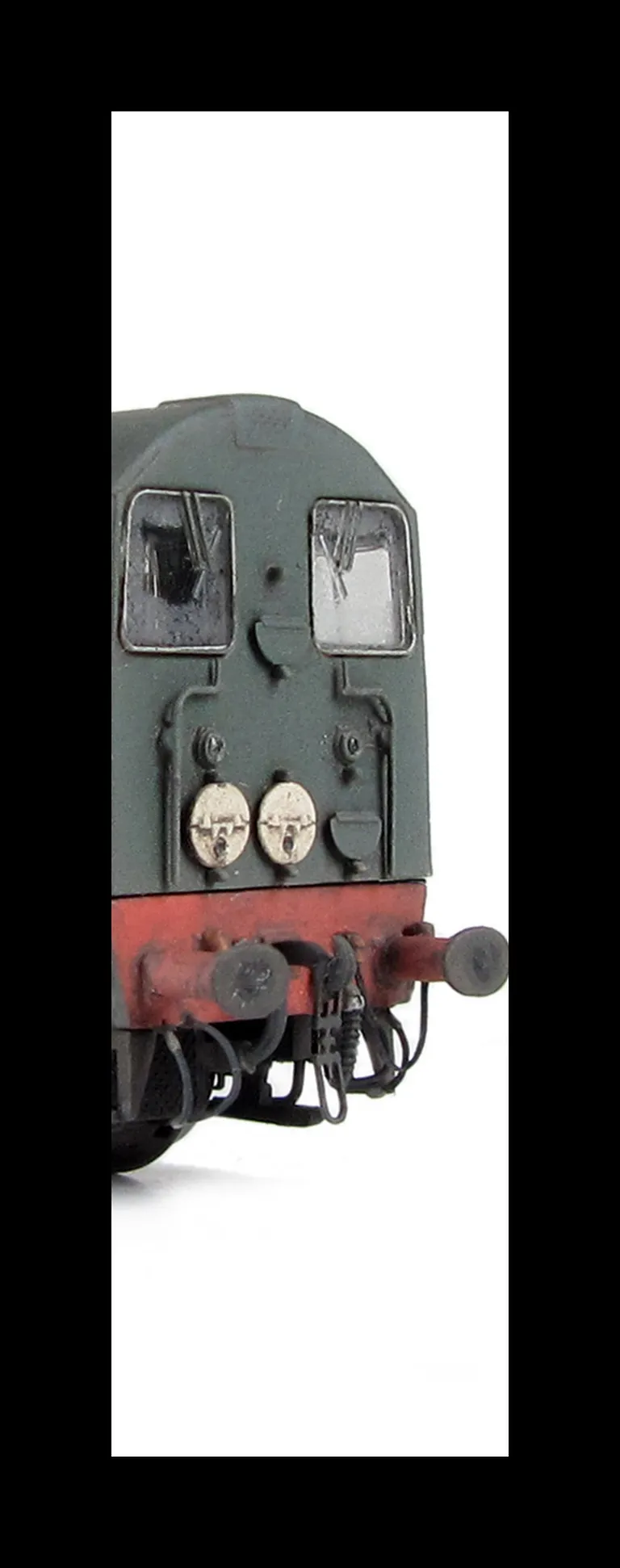 D8001 with faded body, cab and nose ends detailed with fine discs and holes filled, roof grills replaced with much finer etched fan and grill, bogie modification to reduce the gap between body and bogies, etched cab end rails added, renumbered, horn grill