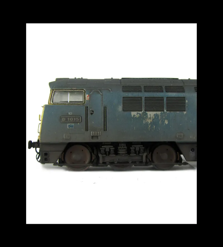 Close up showing the smaller holes on the wheels and the distressed flaking body work.