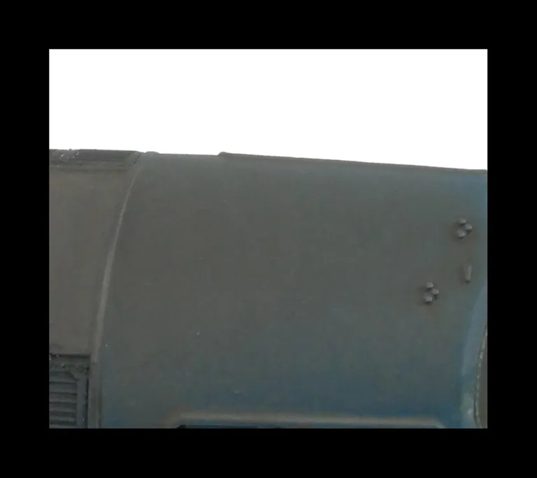 Close up of air horn brackets on roof.